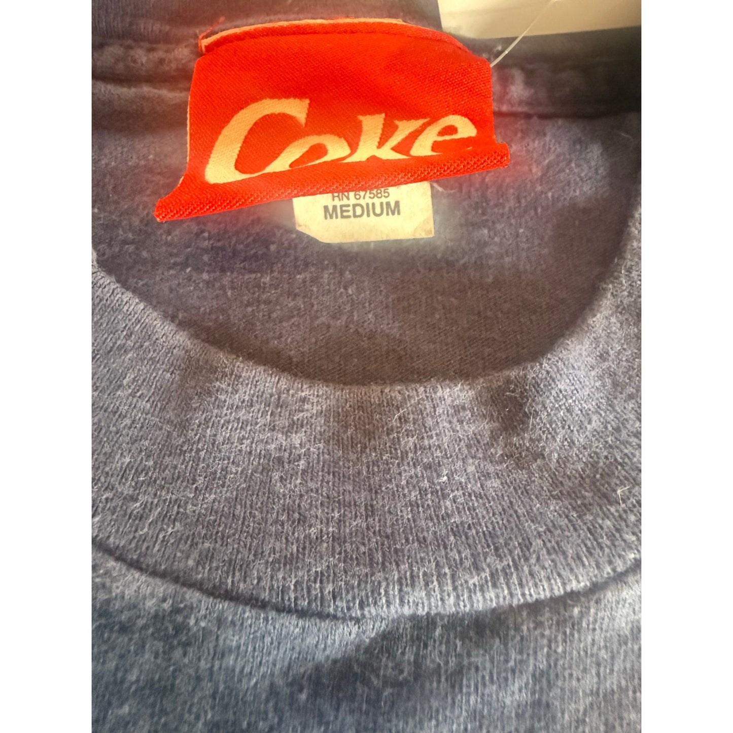 1996 Coke flexing a six pack size Medium